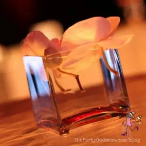 Event Lighting: Take It To The Next Level! Light it up! The Party Goddess, LA's best full service event planner, shares event lighting ideas and inspiration to make any party ridiculously fabulous! Check it out at https://thepartygoddess.com/event-lighting-take-next-level @leannaazzolini #eventlighting #eventlightingideas - floral arrangement image