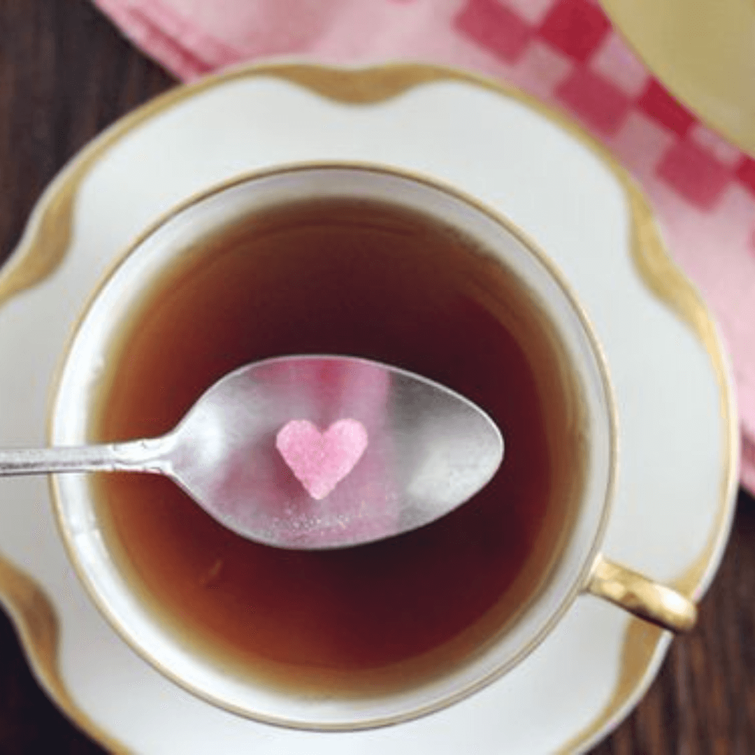 22 Valentine Brunch Ideas For Friendsgiving - heart sugar cube and tea cup  - The Party GoddessThe Party Goddess