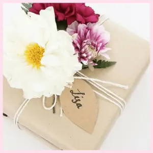 present wrapped with flowers on top