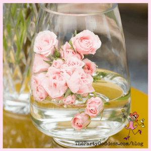pale pink flowers in a vase with water