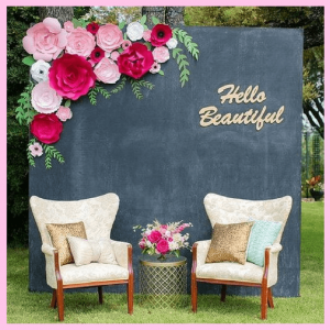 2 chairs, chalkboard and flowers to create a photo backdrop