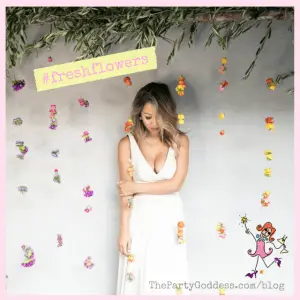 fresh flower photo backdrop with girl dressed in a white dress
