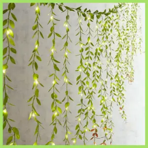 Spring Centerpieces Beyond Floral Arrangements! - garland of leaves wrapped with lights