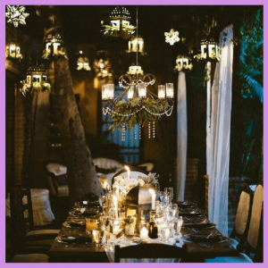 Push For Purple: 16 Ultra Violet Wedding Styles - hanging lanterns and star lights over lighted tablescape