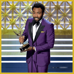 Push For Purple: 16 Ultra Violet Wedding Styles - Donald Glover in a purple tux receiving an award