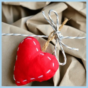 Picnics, BBQ & Boozy Menus For Memorial Day! - close up of red heart tied on brown wrapped package