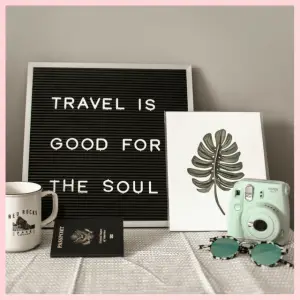 15 Best Trip Planning Hacks To Help You Save! - travel sign with a passport, mug, camera, print and sunglassess