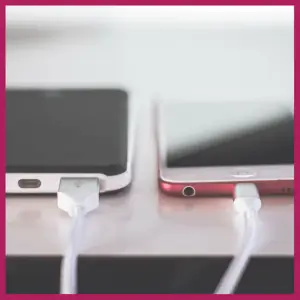 15 Best Trip Planning Hacks To Help You Save! - 2 cell phones being charged