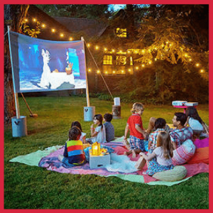 Beat The Heat Backyard Summer Parties For Kids! - people watching a backyard movie