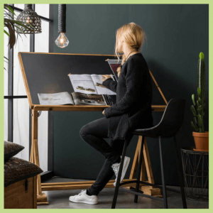 Cool Office Makeovers For Home & Businesses! - lady sitting at a drafting table
