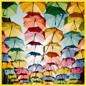 Cool Office Makeovers For Home & Businesses! umbrellas in a rainbow of colors hanging overhead
