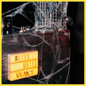 Spooky Alfred Hitchcock Halloween Party Ideas - Bates Motel desk Halloween decor