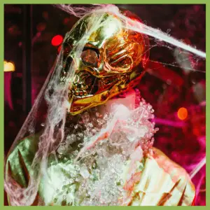 Spooky Alfred Hitchcock Halloween Party Ideas - gold skeletin head with cobwebs
