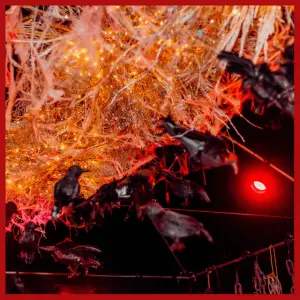 Spooky Alfred Hitchcock Halloween Party Ideas - ravens hanging from the ceiling with straw like nest