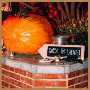 Spooky Alfred Hitchcock Halloween Party Ideas - large pumpkin to guess the weight