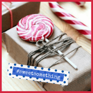Gift Wrapping: The Presentation Of Presents! - red and white swirl lollipop tied on top of a gift