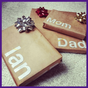 Gift Wrapping: The Presentation Of Presents! - 3 presents wrapped in kraft paper with a box and large letters for the name