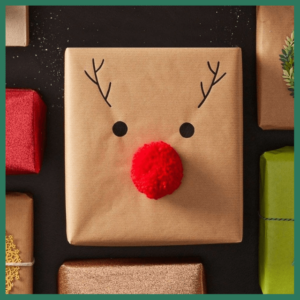 Gift Wrapping: The Presentation Of Presents! - gift wrapped in kraft paper with Rudolf's red nose, eyes and antlers on it