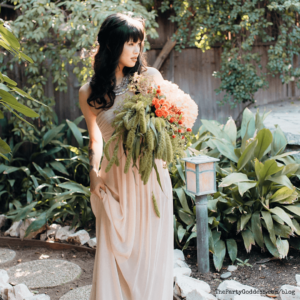 7 Boho-Chic Backyard Wedding Tips During Covid - bride in backyard with bouquet