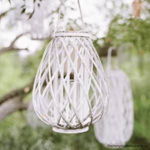 7 Boho-Chic Backyard Wedding Tips During Covid - outdoor white hanging candle holder